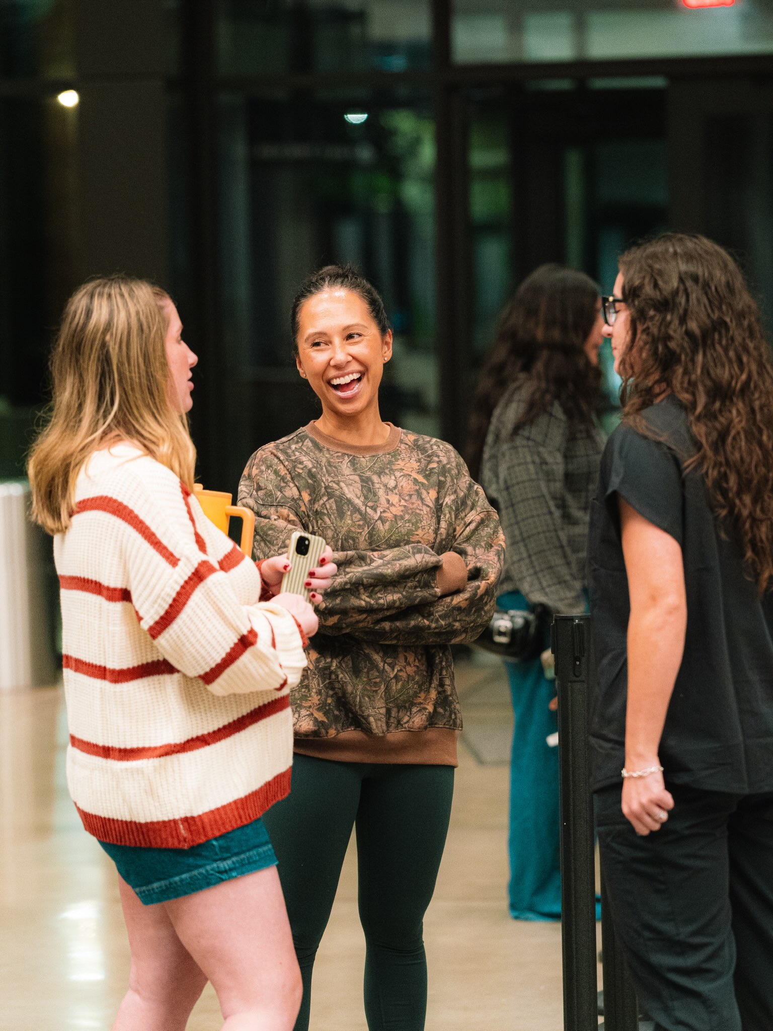 Friends smiling and connecting in conversation