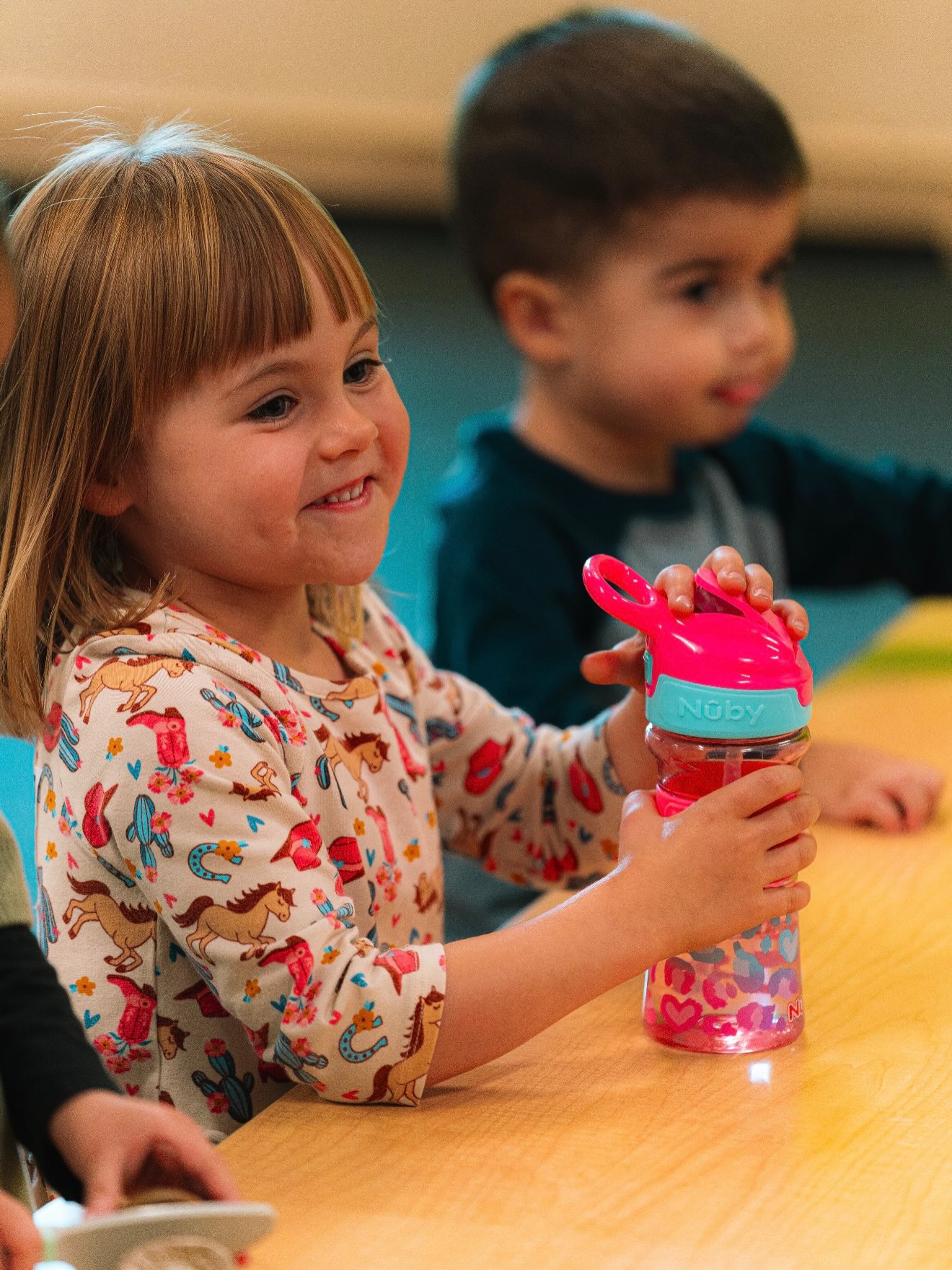 A child smiling during activities at Life Fellowship Kids