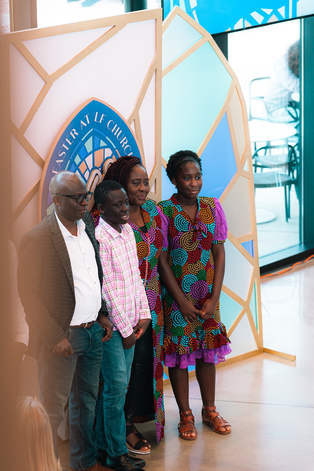 People standing together near a lobby display